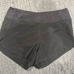 Athleta black run with it shorts 3”